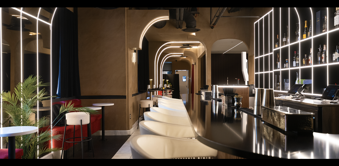 The illuminated bar and shelving inside KATA DC